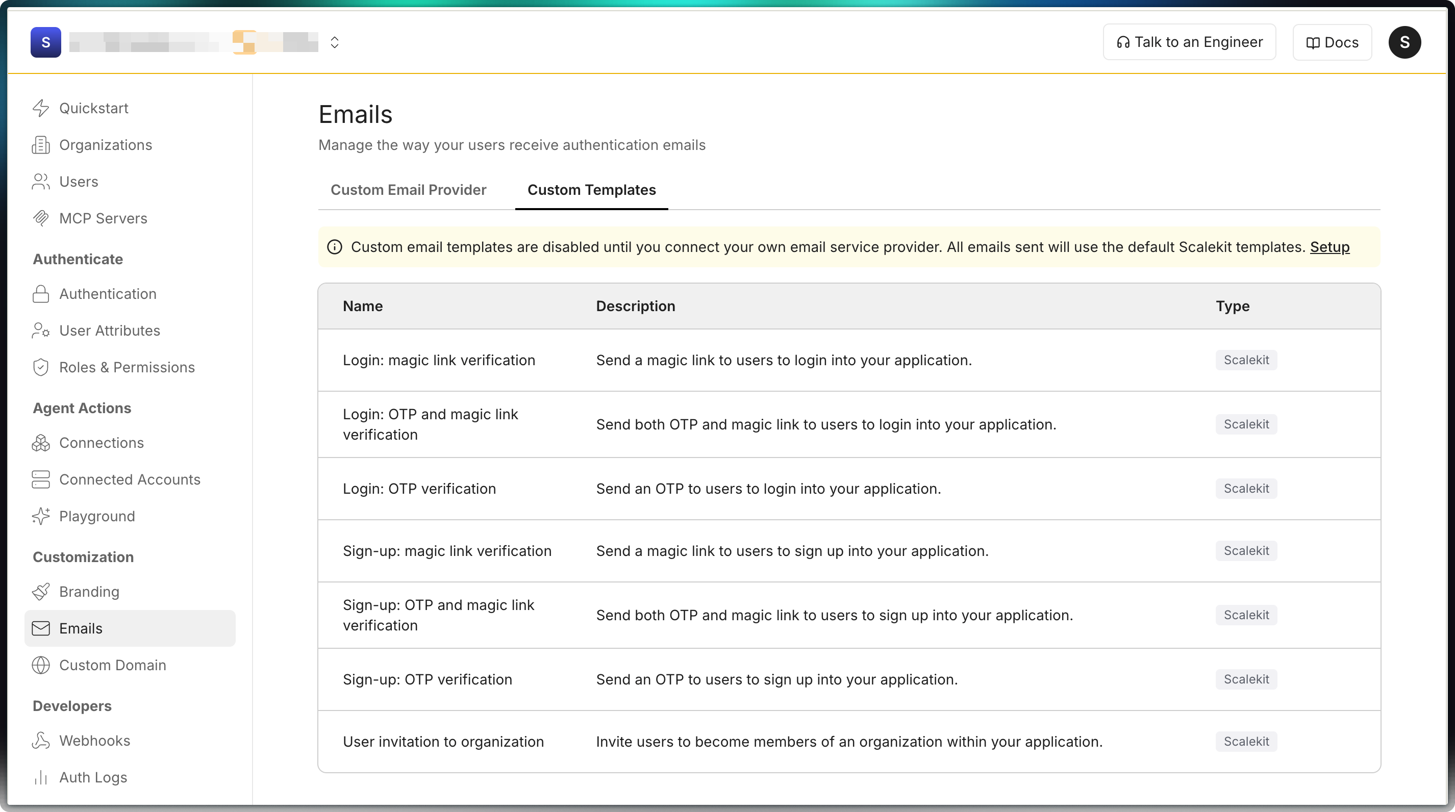 Emails Custom Templates tab listing authentication email templates for login, sign-up, and organization invitations, each using the Scalekit type